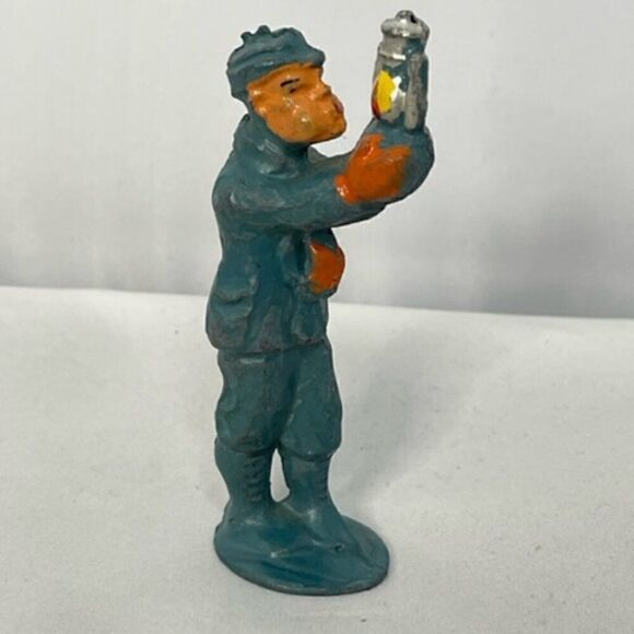 Vintage MANOIL 3.5" Figurine Lead Toy 41/16 Man Blowing Out Lantern - Picture 1 of 5
